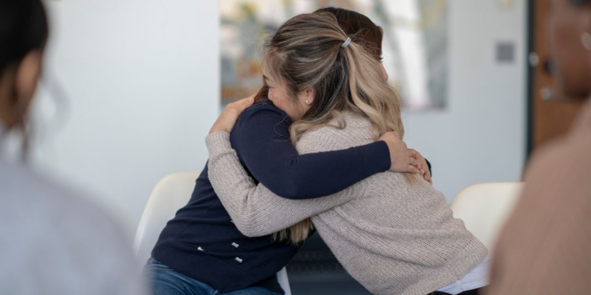 Two people hugging