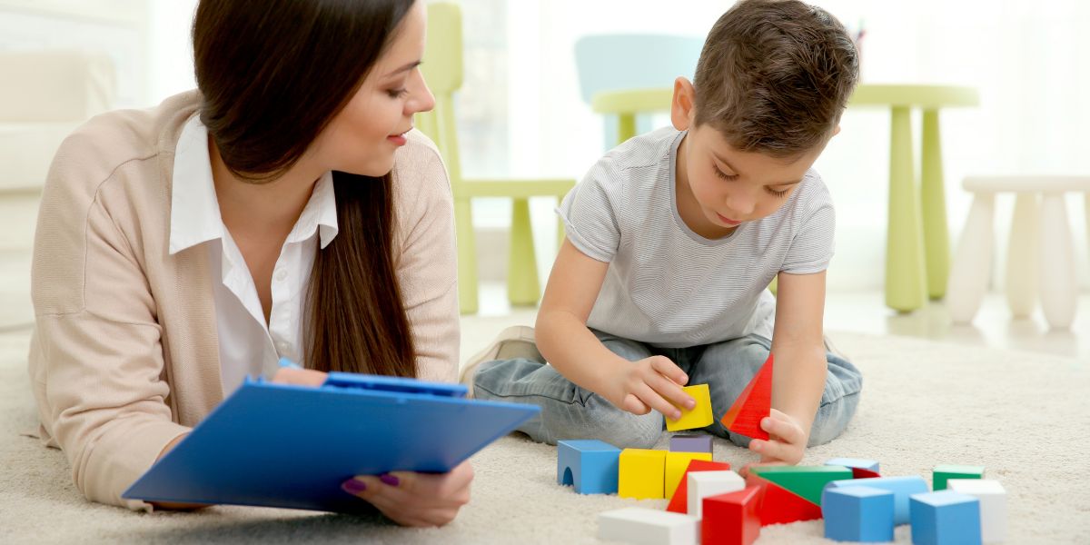 Therapist and child playing