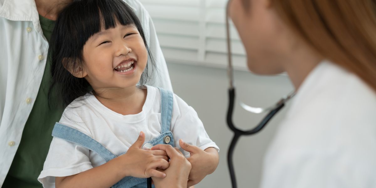 Child smiling at pediatrician