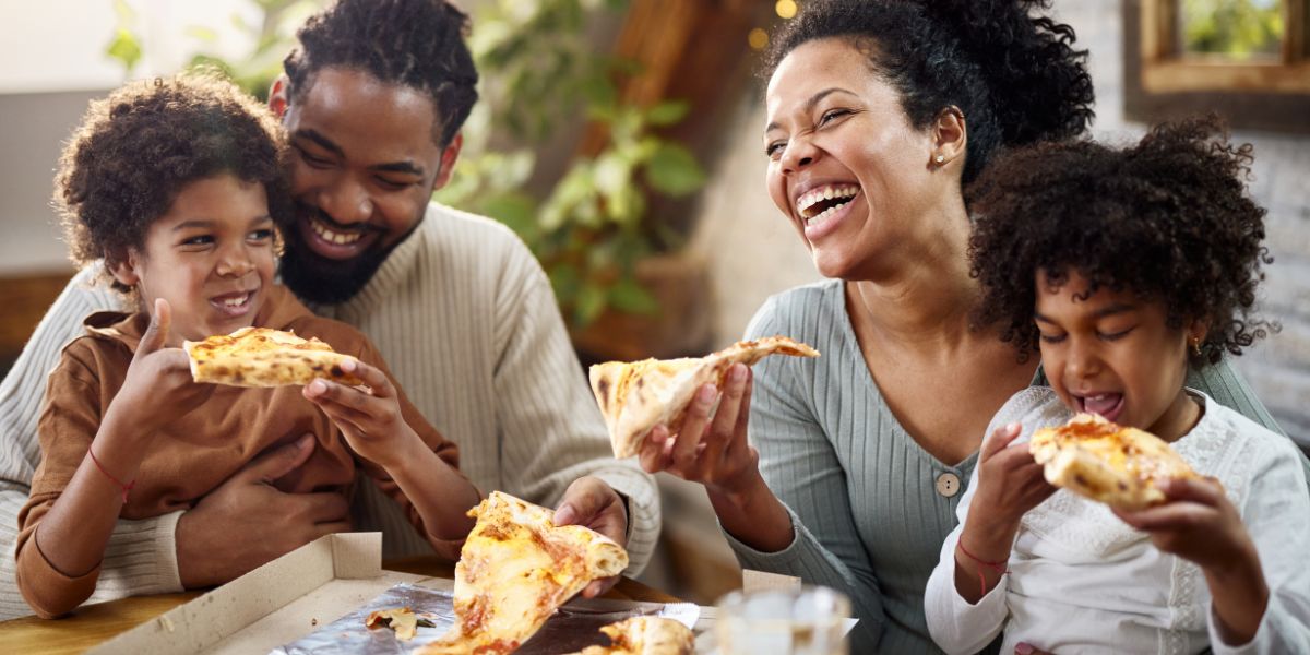 Smiling family having a meal together