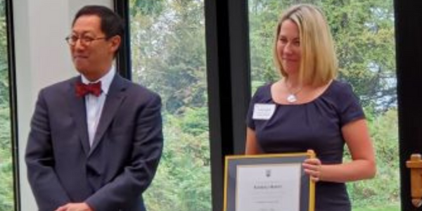 UBC President Santa Ono and Kim Marty with her framed award