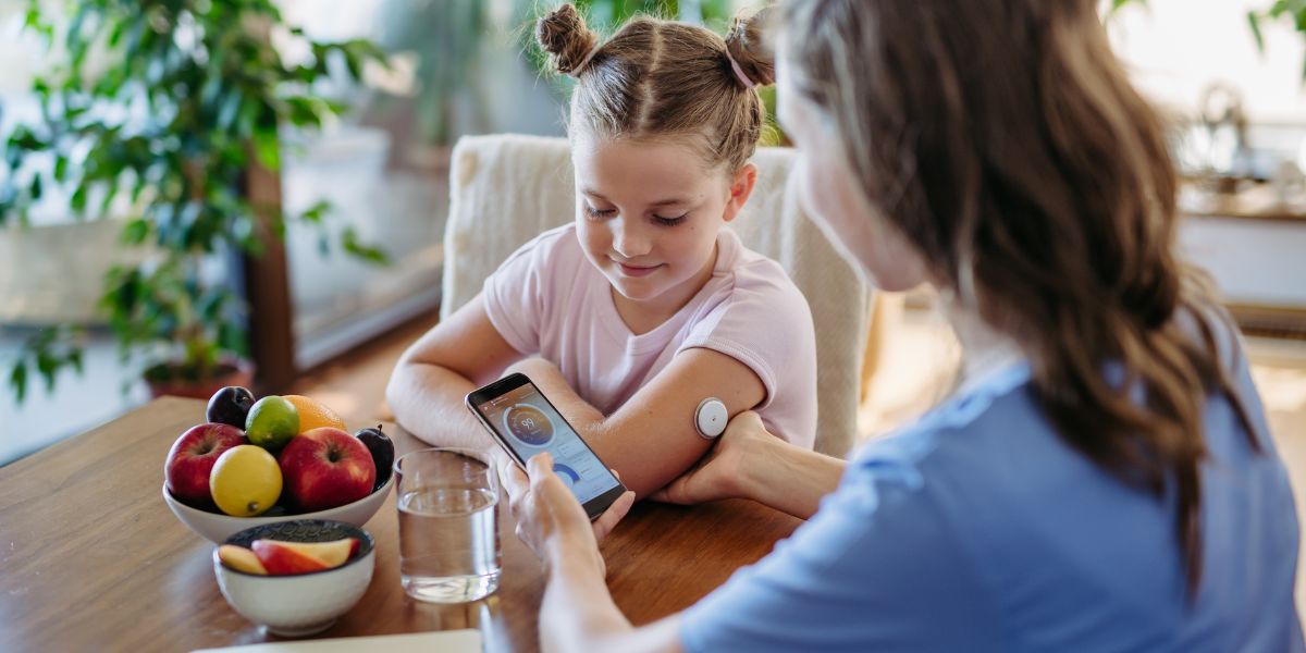 A child with type 1 diabetes (T1D) using continuous glucose monitor (CGM)